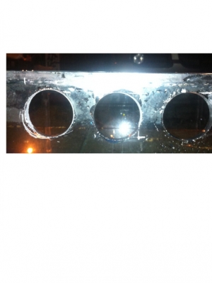 Overflow holes that I drilled with a Glass-holes hole saw for their 1" bulkheads.