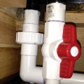 The back PVC pipe has a quick disconnect union (return to display tank) so I'm able to disassemble when I move the tank. The PVC closes to you has a ball valve to regulate the siphon (return to sump/refugium)