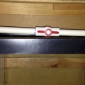 Return to display tank. Has a ball valve as well to regulate the flow for the pump.